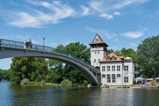 Berlin, Germany – June 03, 2023: Abteibrücke, Abbey Bridge to the Kulturhaus Insel, a popular venue in the middle of the River Spree in Berlin's Treptow district