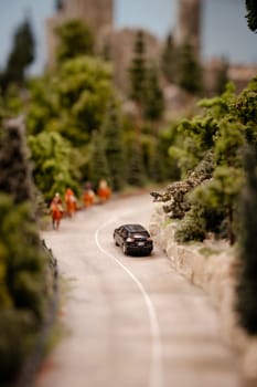 Miniatur Wunderland Hamburg in Germany, car on countryside road , museum with miniature model construction of the world , 12.12.2023
