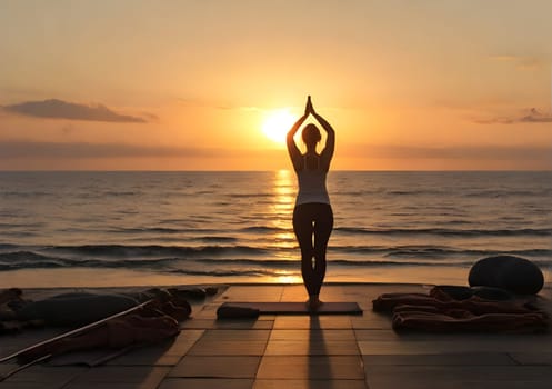 Woman naking yoga at the beach