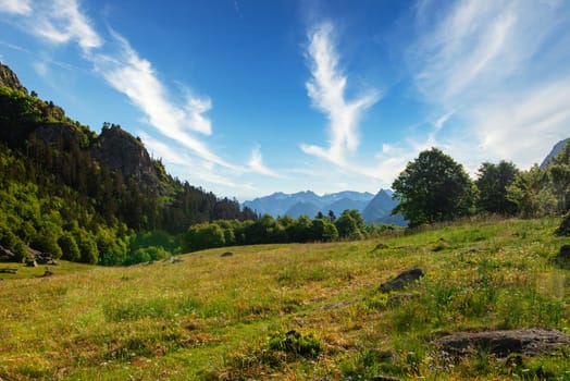 mountain scenery in the Pyrenes with fresh green meadows on a beautiful sunny ay in springtime