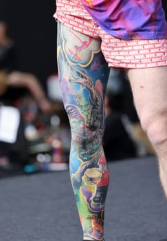 Krakow, Poland - June 12, 2022: Unidentified participant during the contest for the best tattoo at the 15th Tattoofest Convention in Cracow. One of the most prestigious tattoo festivals.