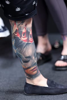 Krakow, Poland -  June 12, 2022: Unidentified  participant at 15th Tattoofest Convention in Cracow. One of the most prestigious tattoo festivals.