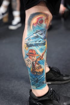 Krakow, Poland - June 12, 2022: Unidentified participant during the contest for the best tattoo at the 15th Tattoofest Convention in Cracow. One of the most prestigious tattoo festivals.