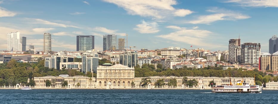 View from Bosporus strait of Dolmabahce Palace, or Dolmabahce Sarayi, located in Besiktas district on the European coast of Istanbul, Turkey