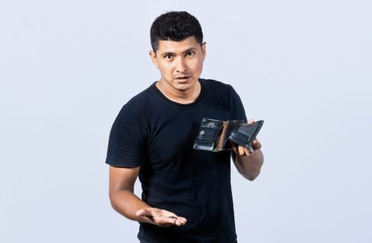 Sad man holding empty wallet and looking at the camera, Unhappy and surprised people looking into an empty wallet, guy seeing his empty wallet, Man with financial problems
