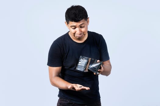 Unhappy and surprised people looking into an empty wallet, guy seeing his empty wallet, Man with financial problems, Sad man holding empty wallet and looking at the camera