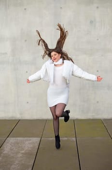 happy young woman with blowing hairs