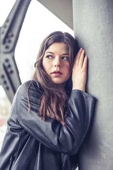 pensive young woman in the city