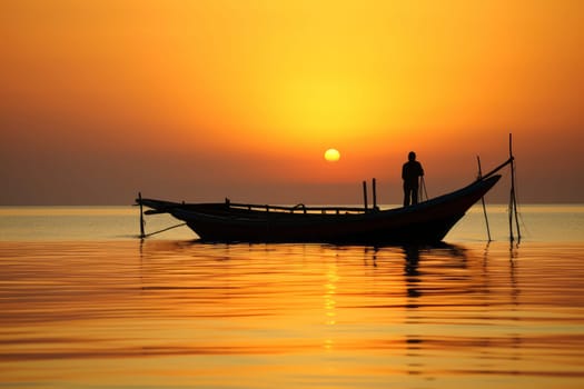 Silhouette of a Person Standing on a Boat at Sunset. High quality photo