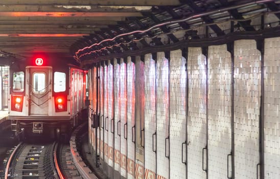 train arrives in the underground station in New York