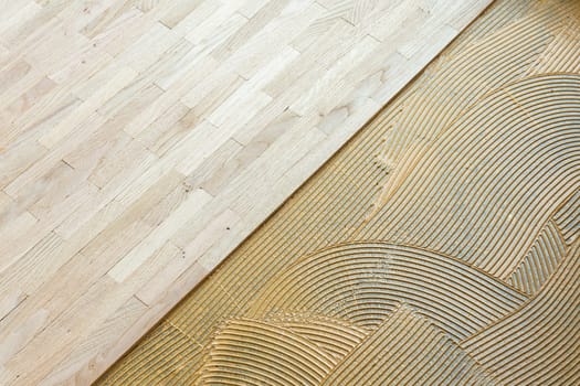 pattern of glue for fixing the parquet at the construction site