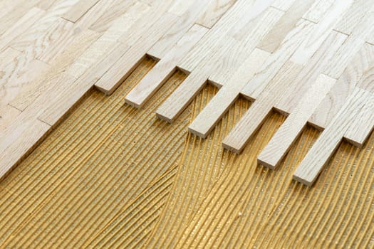 pattern of glue for fixing the parquet at the construction site