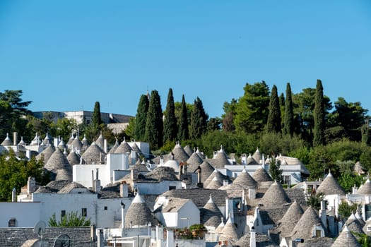 scenic historic stone trullis in Alberobello, Italy
