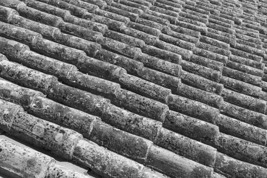 pattern of old red roof tiles gives a harmonic background