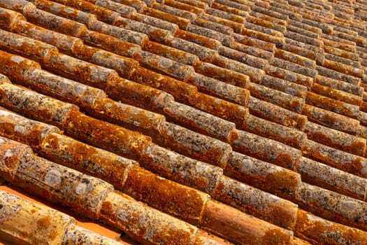 pattern of old red roof tiles gives a harmonic background