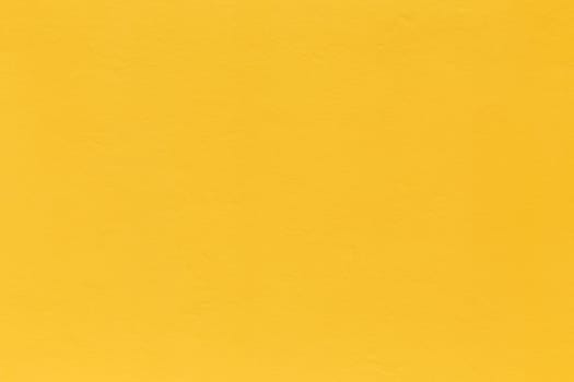 pattern of bright yellow painted old plaster wall as harmonic background