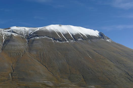 National park of the sibillini mountains. fields in castelluccio di norcia, umbria, italy