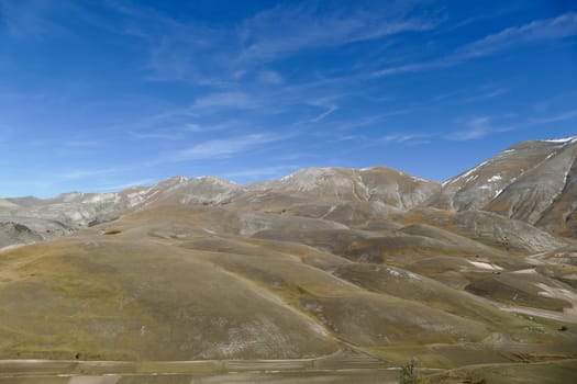 National park of the sibillini mountains. fields in castelluccio di norcia, umbria, italy