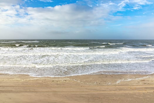 scenic landscape in Sylt with ocean, dune and empty beach in spring time