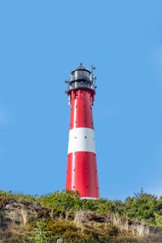 lighthouse of Hoernum on Sylt island, Germany. Landmark, tourist attraction and guiding light for navigation on the North Sea.