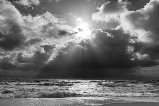 sea landscape with huge waves and sunbeam at the island of Sylt, Germany