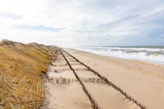 dune landscape at the west beach in List a t the island of Sylt in Germany with north sea view at low tide