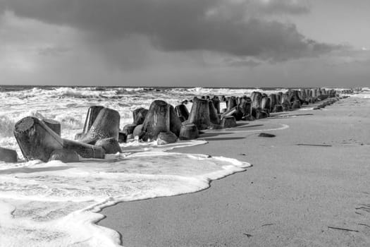wind breaker at the coast in Sylt in bad weather storm, Hoernum