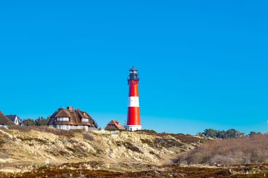 lighthouse of Hoernum on Sylt island, Germany. Landmark, tourist attraction and guiding light for navigation on the North Sea.