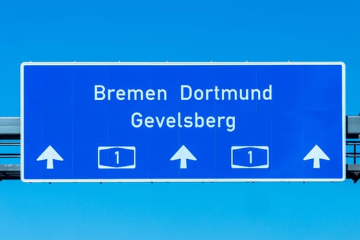 highway signage Bremen Dortmund Grevelsberg continuing on highway no 1 in Germany under blue sky