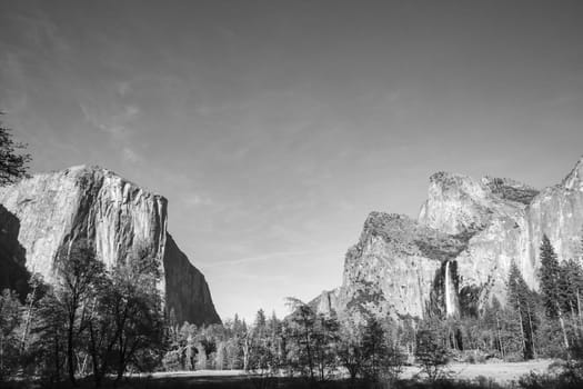 scenic view in Yosemite valley to mountains of el capitan and cathedral rock, USA