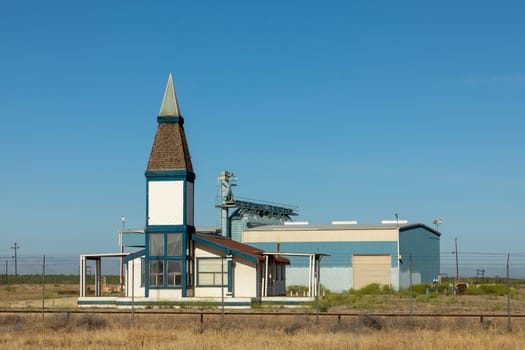scenic landscape in Bakersfield with  fields, industry and a little church in the middle of nowhere, USA
