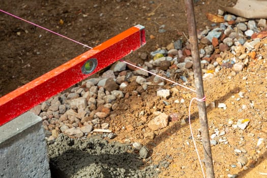 accurate measurement with spirit level to install the curbs in detail