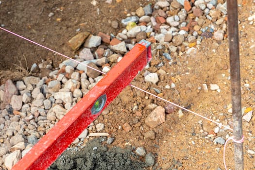 accurate measurement with spirit level to install the curbs in detail
