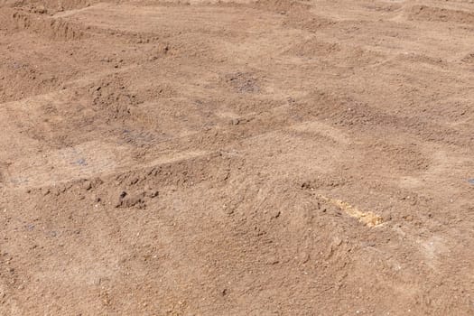 pattern of fresh potting soil for laying a new lawn with green grass