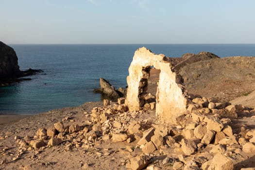 beautiful Papagayo beach in Playa Blanca, Lanzarote with old ruin of fishermens hut