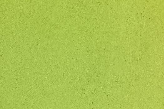pattern of harmonic yellow neon colored plaster wall background