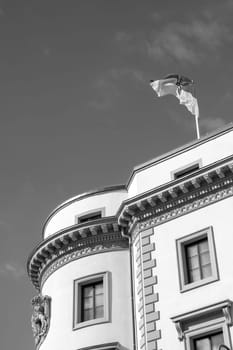 view to parliament of Hesse in Wiesbaden, a former castle, with Hesse Flag at roof top under blue sky