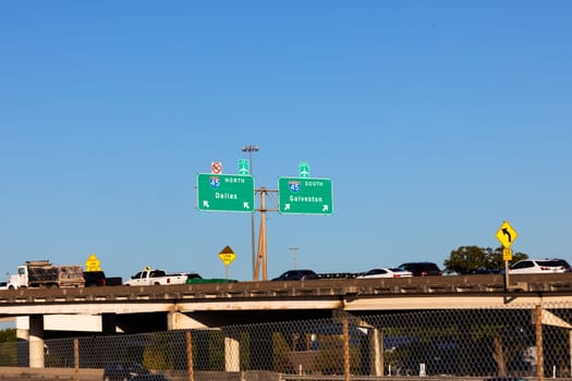 highway 45 with direction signage Dallas and Galveston under blue sky