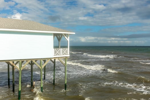 typical house on stilts to prevent damage by flooding in stormy weather  as nearly every wooden house at the coast in Texas is constructed this way, Galveston, USA