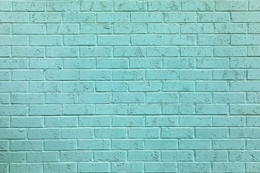 old brick wall painted in light blue in Galvaston