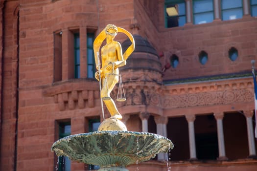 Lady Justice Statue on Water Fountain with San Antonio Downtown Building in Background, Texas, USA