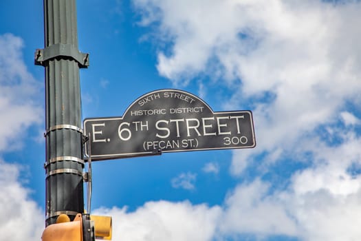 street sign 6th street - pecan street -  in Austin, Texas, historic district, Texas, USA