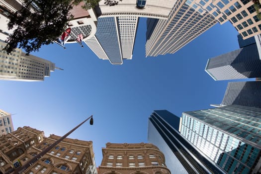 fisheye view of historic skyscraper in old town od Dallas under blue sky.