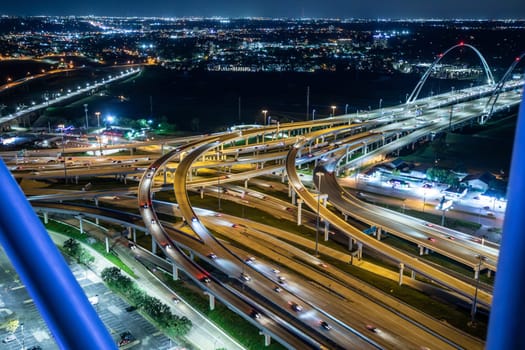 scenic skyline of Dallas by night with view to the highways and bridges, Texas, USA