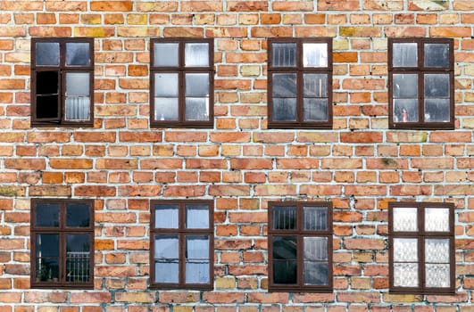 background of old brick wall with rotten windows in Copenhagen, Denmark
