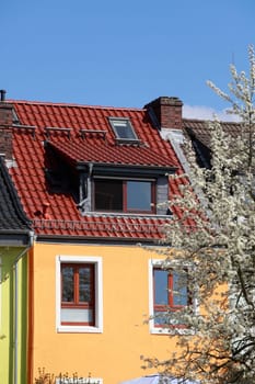 Orange residential building in spring, Bremen, Germany