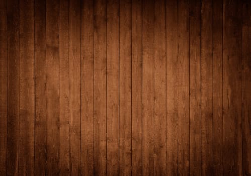 Wooden background made of vertical brown boards with darkening on the sides