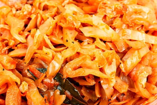 Appetizing stewed cabbage on a plate. German cuisine.