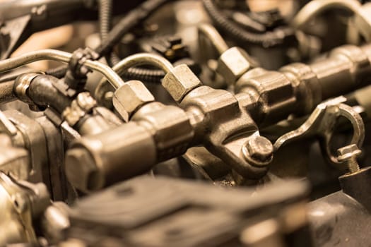 Close-up photo of common rail diesel injectors, highlighting the intricate components of fuel injection.