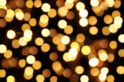 Yellow and gold background with dots of light